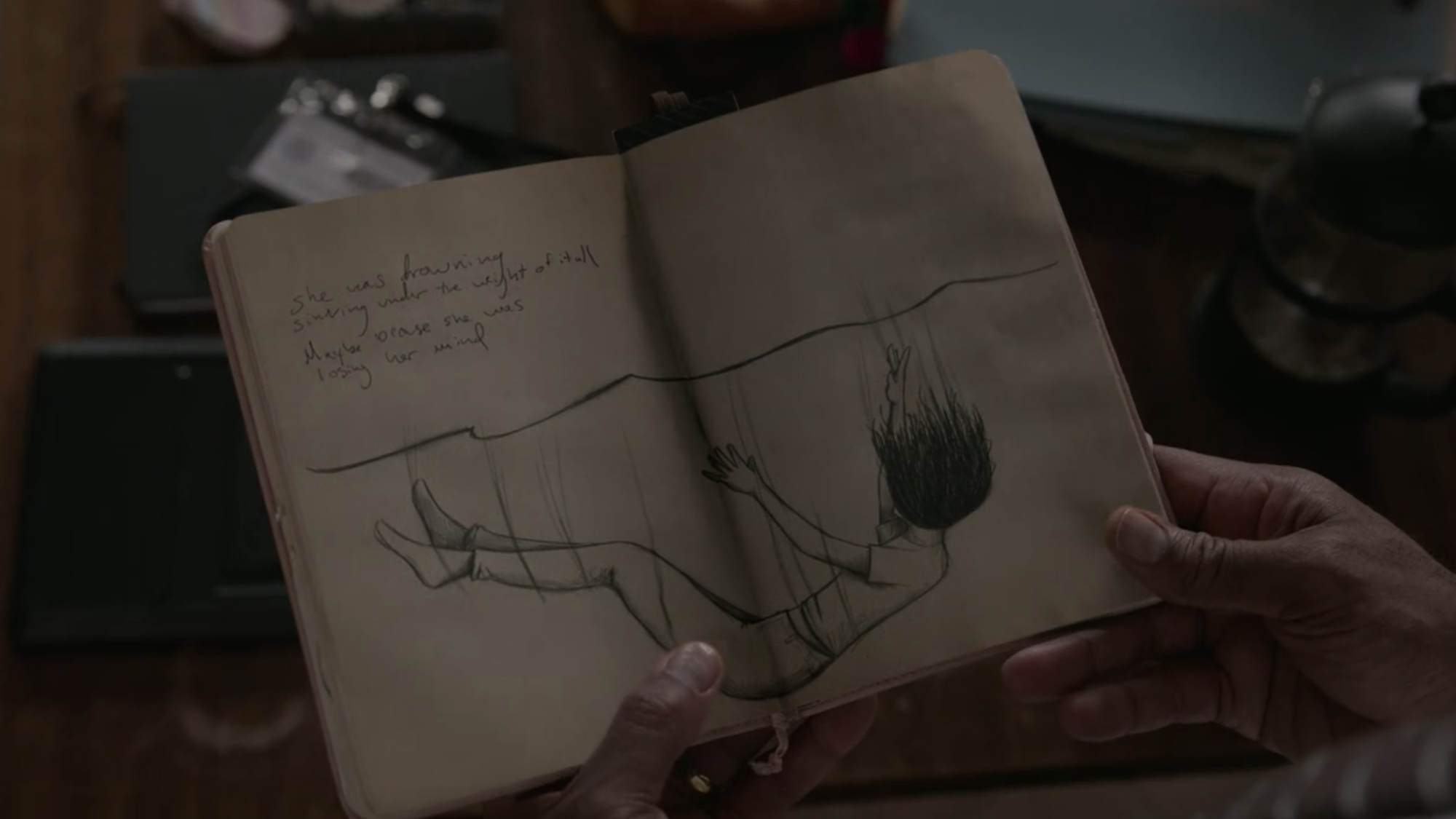 The Wilds S1E09 Nora's Notebook Sketch of Leah Drowning